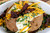 Fire & Smoke Society F&S Onion Butter All Purpose Blend 9.2 Oz, seasoned baked potato topped with sour cream, shredded cheddar cheese, chopped chives, and crispy bacon pieces.