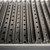 GrillGrate® for PK360, stainless steel grilling grate with elongated slats and evenly spaced holes for enhanced grilling performance.