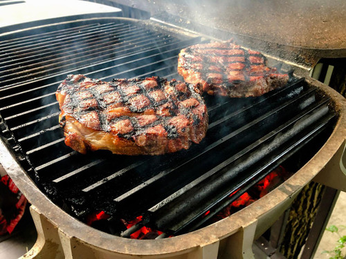 GrillGrate® for PK360, grilling steaks on a barbecue grill.