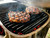 GrillGrate® for PK360, grilling steaks on a barbecue grill.