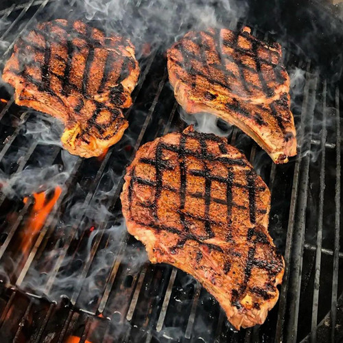 GrillGrate® for The Original & PK300 Grill, cast iron grilling plates with raised ridges and grill marks on searing steaks.