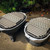 GrillGrate® for The PKGO, two metal grill grates with raised ridges and perforations designed for outdoor portable grill cooking.