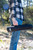 Looft Lighter X Case, portable black carrying case with the brand name Looft printed on it, held by a person outdoors in a forest setting.