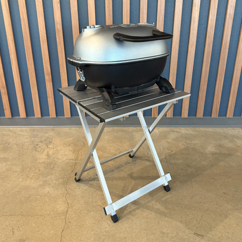 PK Grills Aluminum Compact Foldable Table, portable outdoor table with aluminum surface and foldable legs for camping and barbecues.