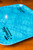 PK Grills Franklin BBQ Tray, blue rectangular BBQ tray with a crackled pattern and black logo.