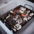 PK Grills PK300 Start Cookin' Bundle - Silver, charcoal briquettes in a grill with glowing embers ready for cooking.