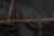 PK Grills The All New PK360 Slim Cover, close-up of black fabric with orange stitching.