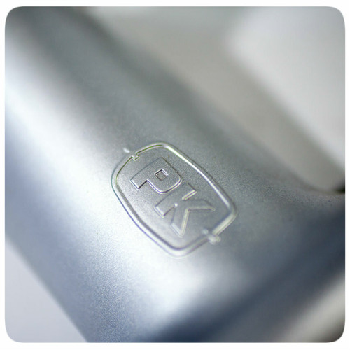 PK Grills The PK360 Grill & Smoker - Classic Silver, close-up of the embossed PK logo on the metallic surface.