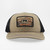 PK Legend Khaki Hat, stylish trucker hat with a beige front panel, black mesh sides, and embroidered mountain landscape patch on the front.